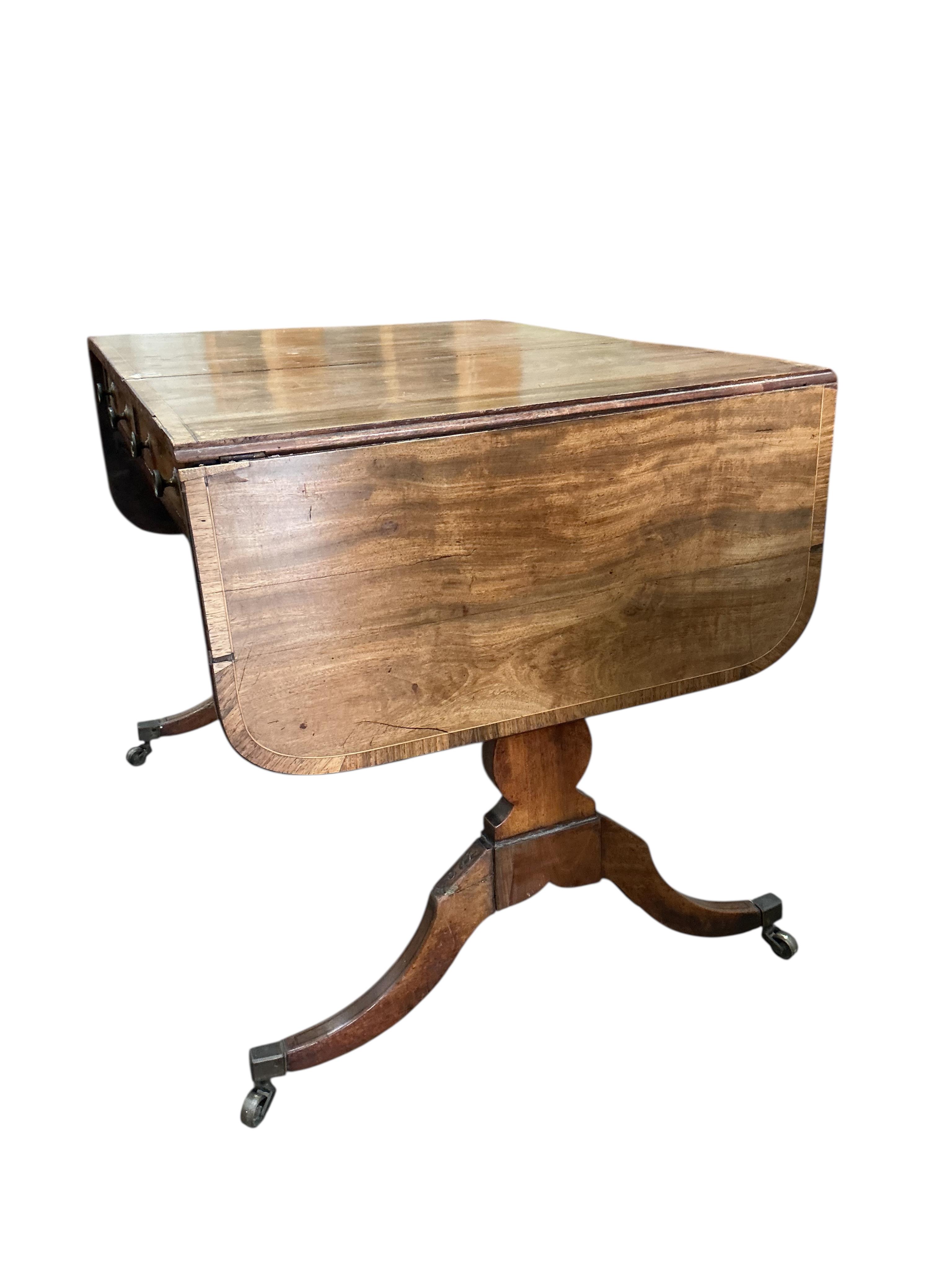 A Regency banded mahogany sofa table, damaged, width 89cm, depth 65cm, height 71cm